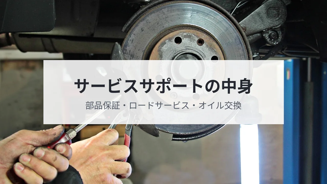 整備士がブレーキを点検している写真